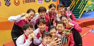 Japan's gold medal-winning BATC women's team take a selfie during the medal ceremony. (photo: AP)