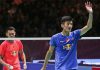 Chen Long (blue shirt) waves at the crowd after he won his All England semi-final match against Lin Dan