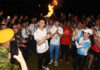 Lee Chong Wei receives Olympic flame from Chan Peng Soon during torch relay. (photo: Penang Olympic Carnival)