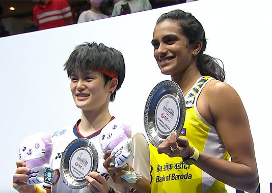 PV Sindhu and Wang Zhiyi pose for pictures at the awards ceremony.