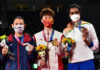 Chen Yufei (middle), Tai Tzu Ying (left), PV Sindhu pose for pictures at the Olympic award ceremony. (photo: Pedro Pardo/AFP)