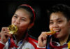 Greysia Polii (L), Apriyani Rahayu showered with cash, cows, houses, vacations after winning gold at the Tokyo Olympics. (photo: Reuters)