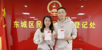 Zhang Nan and Tian Qing show their marriage certificate at the Marriage Registration Office of Beijing. (photo: Zhang Nan's social media)